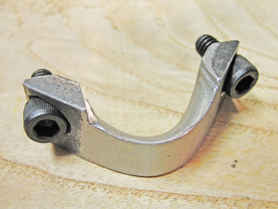 Body clamp that holds gear train onto lathe